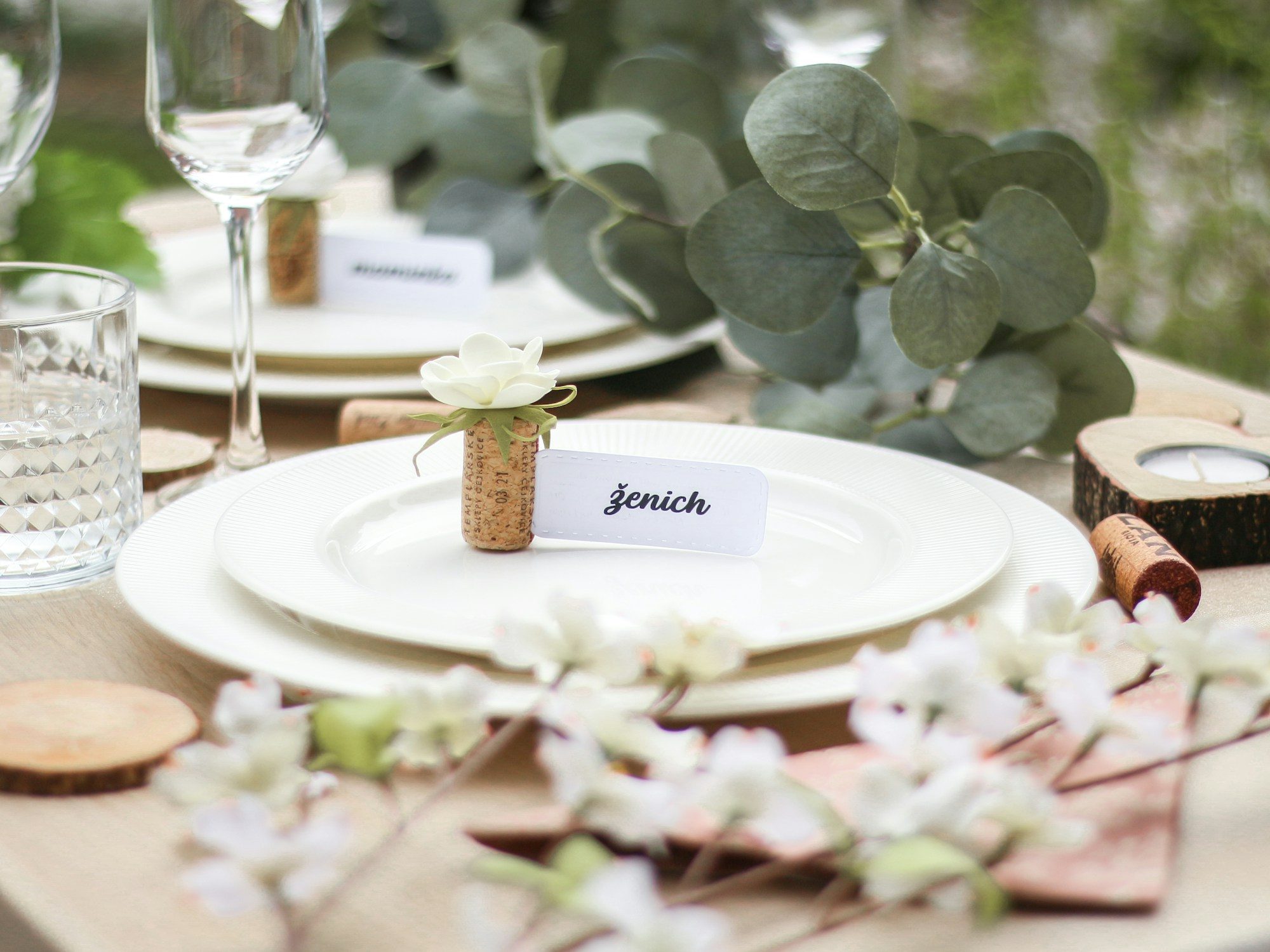 Place cards waiting on a set table, the small paper decisions that hold an evening together.